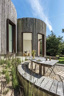 Stay in This Danish Vacation Home Made Up of 9 Log-Clad Cylinders - Photo 3 of 14 -