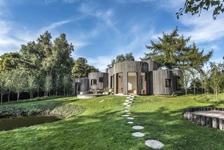 Stay in This Danish Vacation Home Made Up of 9 Log-Clad Cylinders - Photo 4 of 14 -