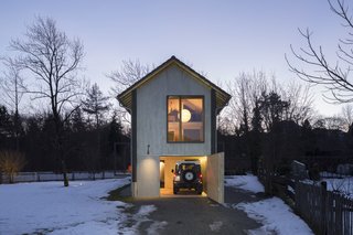 Located in Germany’s Upper Bavarian Inn Valley, this holiday home by architects Christine Arnhard and Markus Eck is only 4 meters wide. Half-offset, stacked rooms that are interconnected are spread throughout the interior volume. Doors to the property’s two floating terraces can be opened to connect the interiors with the outdoors. 