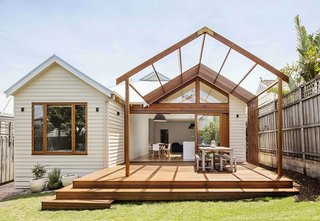 To help the owners of this Edwardian home in Melbourne retain as much outdoor space as possible, and connect the indoor kitchen to the backyard, Sheri Haby Architects designed a patio extension with a timber pergola, which serves as an open-air dining area that’s ideal for summertime barbecues. 