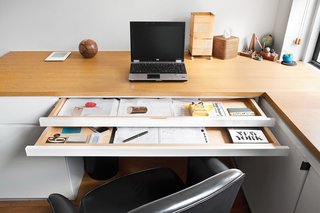 Sliding trays help keep paperwork out of sight.