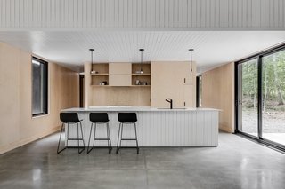 A Lofty Nature Retreat in Quebec Inspired by Nordic Architecture - Photo 12 of 16 -
