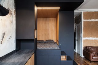 A "space cube" made of Fenix NTM's matte nanotech material and warm oak serves as a sleeping nook and storage.