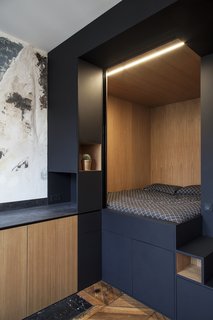 The cube is connected to a kitchenette with built-in cabinetry.