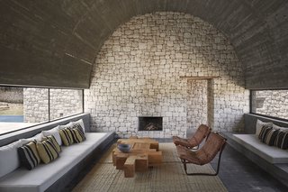 Materials such as unpolished stone, used for the interior walls, speak louder than statement furniture or décor.