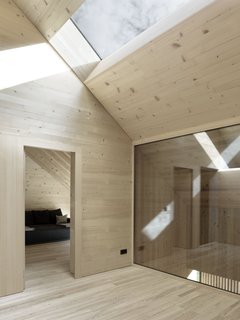 The ceilings of the attic slope downwards towards the level of the cullis to create a more cloistered atmosphere.