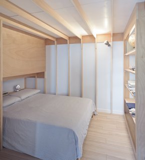 The master bedroom has ribbed ceilings and walls that recall nautical frames.