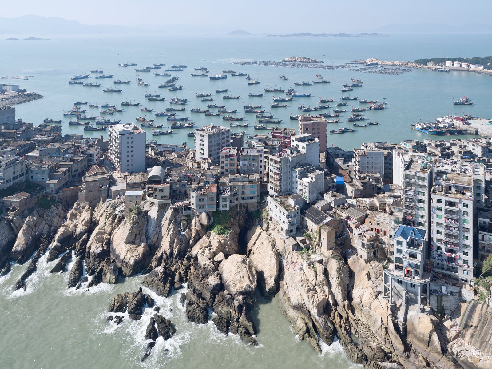 The house is sited on coastal land where erosion and heavy rains are common.