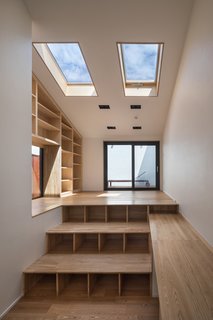 Steps with storage that lead up to the balcony