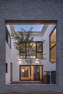 Located on the south side of the house is internal courtyard with a large rectangular section cut out from the southern exterior wall.