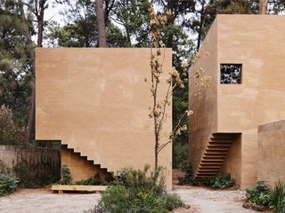 The interior staircases are cut out from the façade.