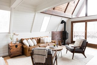An old, European-style fireplace sets the scene for cozy, post-ski evenings.