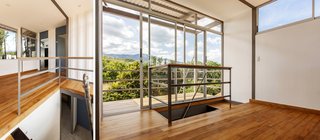 The stairwell leads from the living areas on the ground level to the upper-level bedroom.