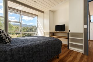 The bedroom with built-in storage along the wall