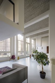 A 20th-Century Dutch Schoolhouse Now Holds a Series of Airy Lofts - Photo 3 of 13 - Over 16-foot-high ceilings allowed for the creation of new intermediate floors and intimate mezzanines.