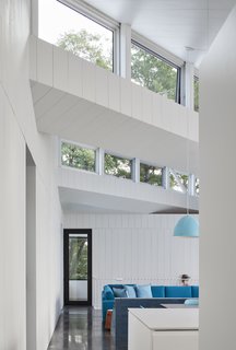 Factory-style skylights are placed on the northern facets of the sawtooth roof.