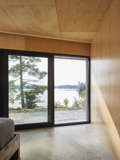 A bedroom enjoys views of the lake.