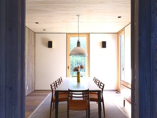 The owners also chose a suspension lamp by Fontana Arte to hang over the dining table.
