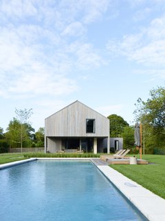 A view of the expansive lap pool leading up to the house.