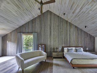 On the second level, a porch "cut-out" separates the master bedroom from the two children's bedrooms on the opposite end.