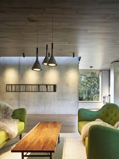 The owners opted to use a raw steel box as a storage system for their collection of vintage vinyl records. <br>