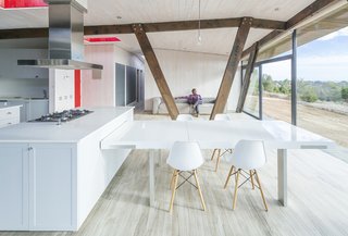 Exposed pine trusses support the roof structure.
