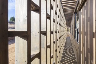 Large openings in the latticework facade brings in warming sunshine and fresh sea breezes.