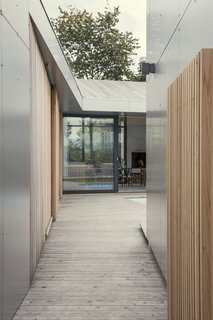 A long walkway leads to the pool.