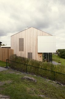 Here's a look at the new siding of the renovated prefab.