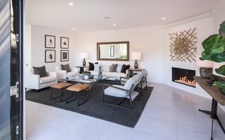 Red Hot Chili Peppers Frontman Anthony Kiedis' Former L.A. Abode Asks $3.2M - Photo 6 of 13 - A wood-burning fireplace in the living room helps create an inviting atmosphere.
