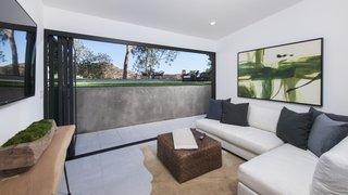 Red Hot Chili Peppers Frontman Anthony Kiedis' Former L.A. Abode Asks $3.2M - Photo 5 of 13 - A living lounge near the rear yard opens up to the surroundings.