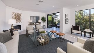 Red Hot Chili Peppers Frontman Anthony Kiedis' Former L.A. Abode Asks $3.2M - Photo 3 of 13 - Retracting walls of glass encourage indoor/outdoor living.