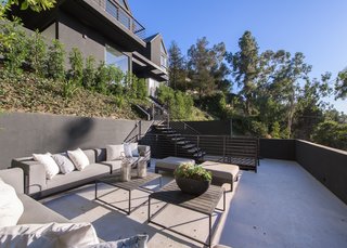 Red Hot Chili Peppers Frontman Anthony Kiedis' Former L.A. Abode Asks $3.2M - Photo 4 of 13 - An outdoor terrace on the slope of the property offers additional lounging and entertainment areas.