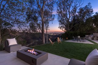 Red Hot Chili Peppers Frontman Anthony Kiedis' Former L.A. Abode Asks $3.2M - Photo 12 of 13 - A stacked-stone fire pit and spectacular canyon views encourage outdoor living.