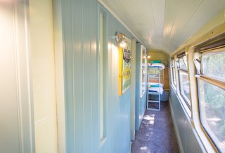 Two bunk beds are located on the upper deck of the bus.