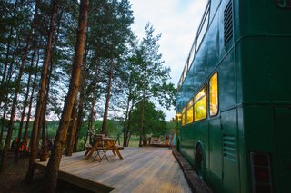 The bus stays "parked" in a peaceful wooded site in the Sussex countryside.