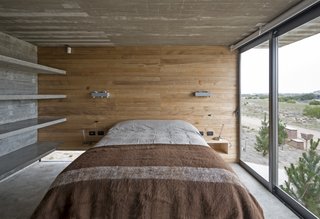 This Stacked Concrete Home Is Not Your Typical Golf Course Dwelling - Photo 15 of 17 - Concrete shelves have also been built into a few of the guest bedrooms.
