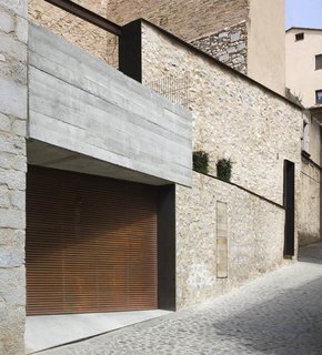 The property has a discreet street-level garage.