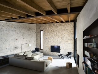 Contemporary materials—such as concrete and steel—are a wonderful contrast to the ancient stone walls.