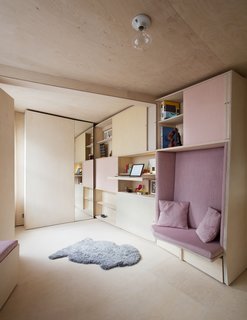 A pullout desk is hidden underneath one of the shelves.