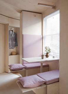 The breakfast booth has extendable seating to accommodate guests.