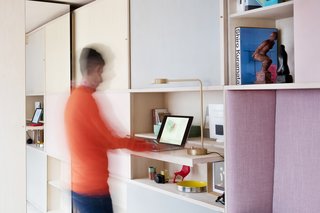 One of the units even opens up to reveal a small pull out desk for a standing workstation.