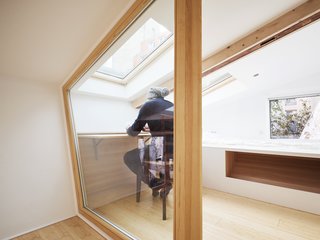 Before and After: A Renovated Artist's Studio Is Now an Airy, Efficient Home - Photo 11 of 16 - A skylight illuminates the retractable desk in the lofted workspace.