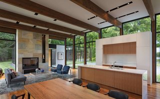 The open-plan kitchen, living room, and dining area are located in the largest wing.