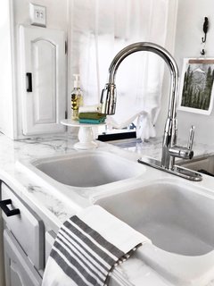 This gray, Hemnes/Rattviken sink cabinet is from IKEA and with two drawers.