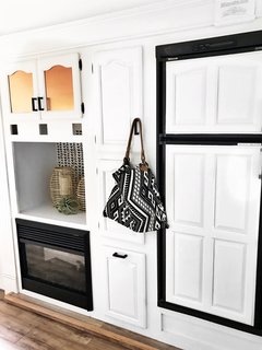 Clean white cabinetry blends in with the walls to make the space feel larger.