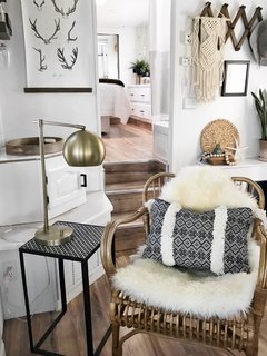 A sheepskin rug, a weave hanging on the wall, and vibrant fabrics add much personality to the newly renovated mobile home.