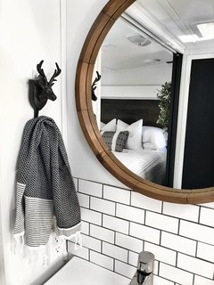 A chrome-plated IKEA Brogrund bath faucet with strainer.