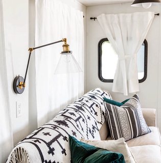 This LNC Plug-in Wall Lamp with a swing arm is from World Market.