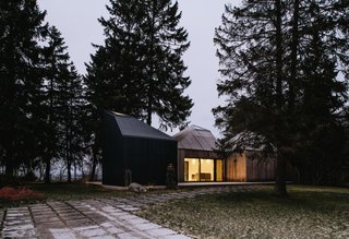 This Forest Retreat Is a Modern Take on the Traditional Estonian Hut - Photo 2 of 12 - The three cabins have north-facing windows that frame views of the Baltic Sea.